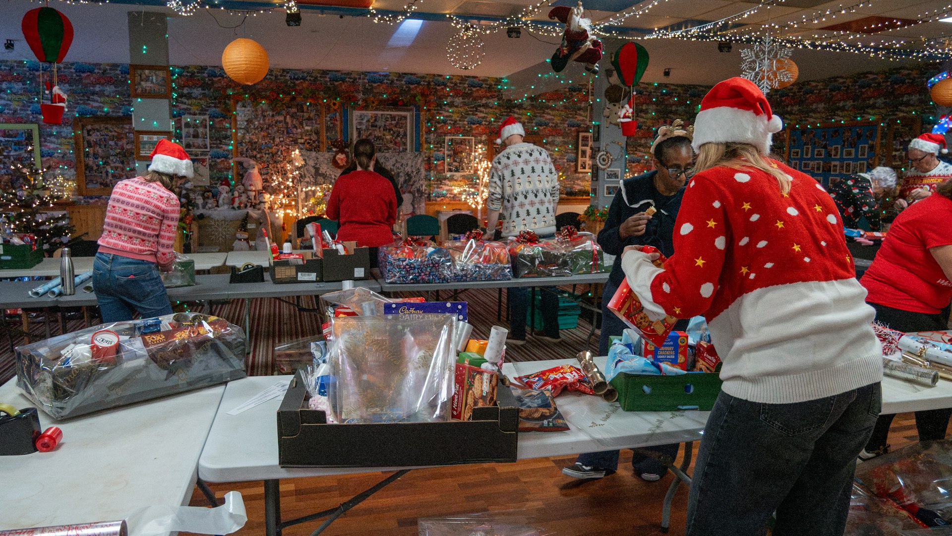 Wrapping Christmas parcels at Ipswich Family Bank